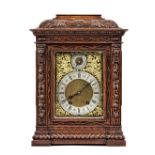 A German oak cased mantel clock, early/mid 20th century, with foliate carved case,