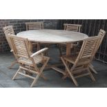 A teak circular garden table on block supports, 150cm diameter x 56cm high,