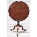 A mid-18th century mahogany circular snap top tripod table on bird cage mount,