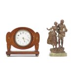 An Art Nouveau style mahogany and inlaid mantel clock, early 20th century, of unusual outline,