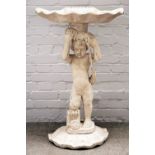 A grey painted carved wood figural console, modelled as a cherub holding a shell,