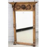 A Regency gilt framed pier glass, with floral moulded frieze and turned columns,