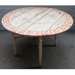 A 19th century Continental painted pine circular table, on folding base, 112cm diameter x 70cm high.