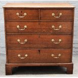 A George III oak chest, with two short over three long graduated drawers on bracket feet,