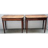 A pair of Regency mahogany card tables each with 'D' shaped tops and inlaid frieze on tapering