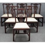 A set of six George III style mahogany pierced splat back dining chairs, on block supports,