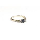 An 18ct gold three stone sapphire and diamond ring,