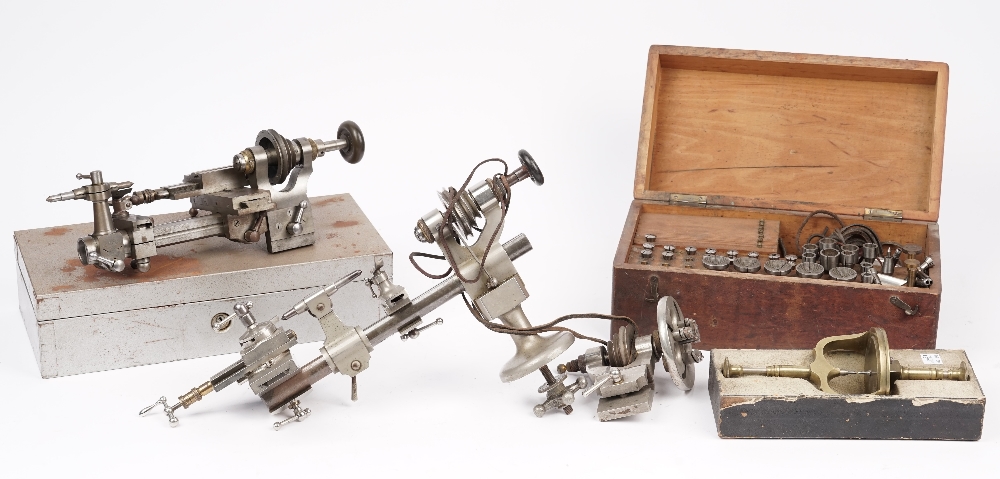 A Horologists steel lathe, a die set and related horological accessories.