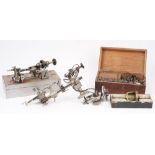 A Horologists steel lathe, a die set and related horological accessories.