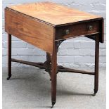 An 18th century mahogany Pembroke table on canted block supports united by 'X' frame stretcher,