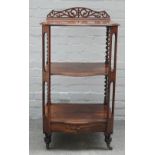 A Victorian rosewood serpentine three tier whatnot, with single drawer base, 59cm wide x 109cm high.