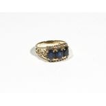 A gold, sapphire and diamond-set dress ring, the three oval-cut sapphires,