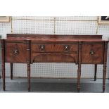 A late George III mahogany sideboard, the brass galleried back over a pair of drawers and cupboards,