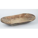 A 19th century sycamore dug out bowl of rounded rectangular form, 70cm wide.