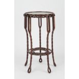 A Chinese hardwood plant stand, the circular top and frieze on pierced rope twist supports,