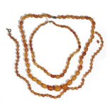 A butterscotch amber bead necklace of graduated design,