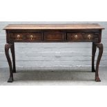 An oak and stained pine low dresser, reconstructed incorporating earlier elements,