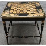 A Victorian and later square games table, the black and gilt chessboard top on turned supports,