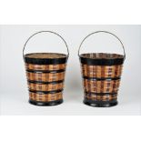 A pair of Dutch part ebonised fruitwood oyster buckets with ribbed bodies,