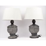 A pair of modern stone effect table lamps,