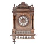 A Black Forest style cuckoo clock of typical form (57cm high) (Pendulum) and a French walnut wall