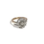 An 18ct gold and platinum, diamond-set nine stone cluster ring, the old mine-cut diamonds,