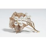 A gold and cultured pearl brooch, of abstract flower design,