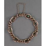 A late Victorian 9ct gold curb link bracelet interspaced by turquoise set oval linking,
