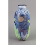 A Tessa Fuchs Studio Pottery vase, incised and painted with a landscape scene, 28cm high.