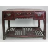 A Chinese crimson lacquered side table,