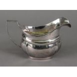 A George III helmet shape silver milk ju