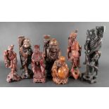 A group of seven Chinese carved wood fig
