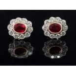 A pair of 18ct gold ruby and diamond-set earstuds of cluster design,