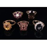 A collection of five 9ct gold and gem-se