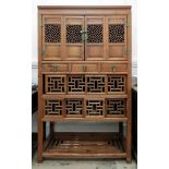 A Chinese stained pine cabinet, having t