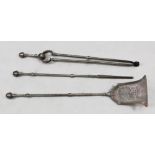 A set of three Victorian steel fire tools, with acorn finials, the shovel of pierced bell shape,