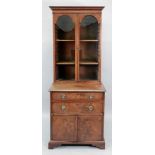 A George III style mahogany satinwood crossbanded boxwood and ebony strung bookcase and associated