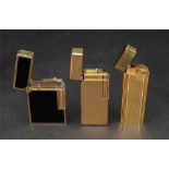 Cartier; a gilt metal lighter of rounded