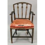 A George III black lacquered gilt chinoiserie decorated open arm elbow chair,