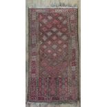 A Belouchi rug, with rust ground within a blue outer border, 116 x 103cm and another,