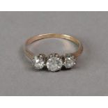An 18ct gold three stone diamond ring, s
