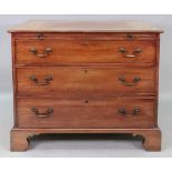 A George III style mahogany chest, circa 1900, with a brushing slide above three drawers,