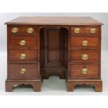 A George III and later mahogany desk, re