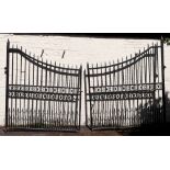 A large and impressive pair of black wrought iron drive entrance gates, fourth quarter 20th century,