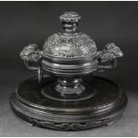 A Chinese black composition two handled censer and cover,