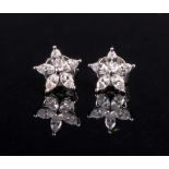 A pair of 18ct white gold and diamond-set earstuds of flowerhead cluster design,