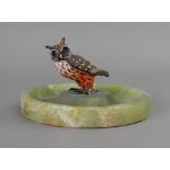 An Austrian cold painted bronze figure of an owl, mounted on a circular green onyx dish,
