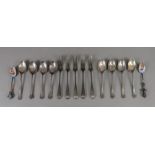 Five Edwardian silver three prong forks,