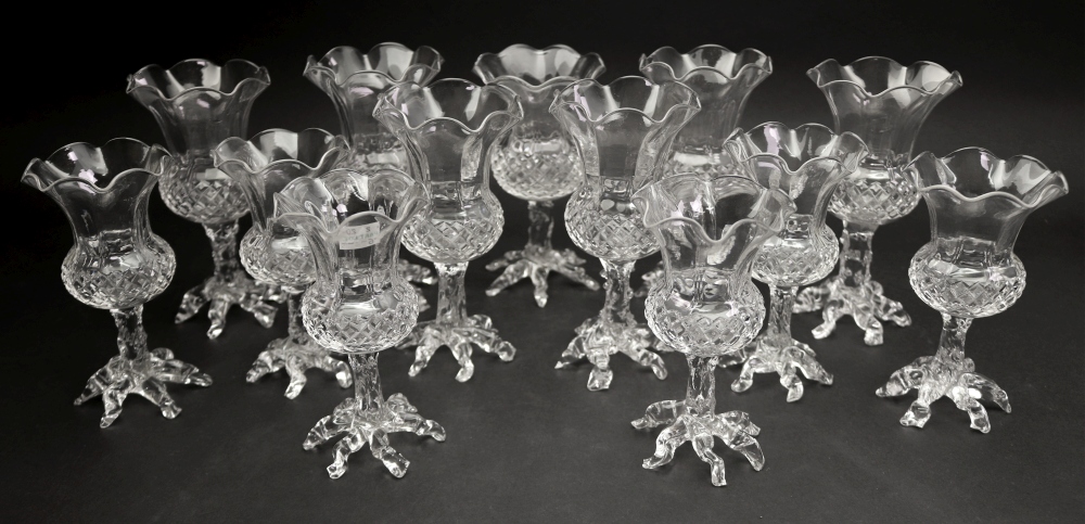 A set of seven glass thistle shape posy vases, late 19th/early 20th century,