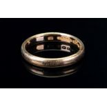A 22ct gold band ring, ring size T, 5.8g